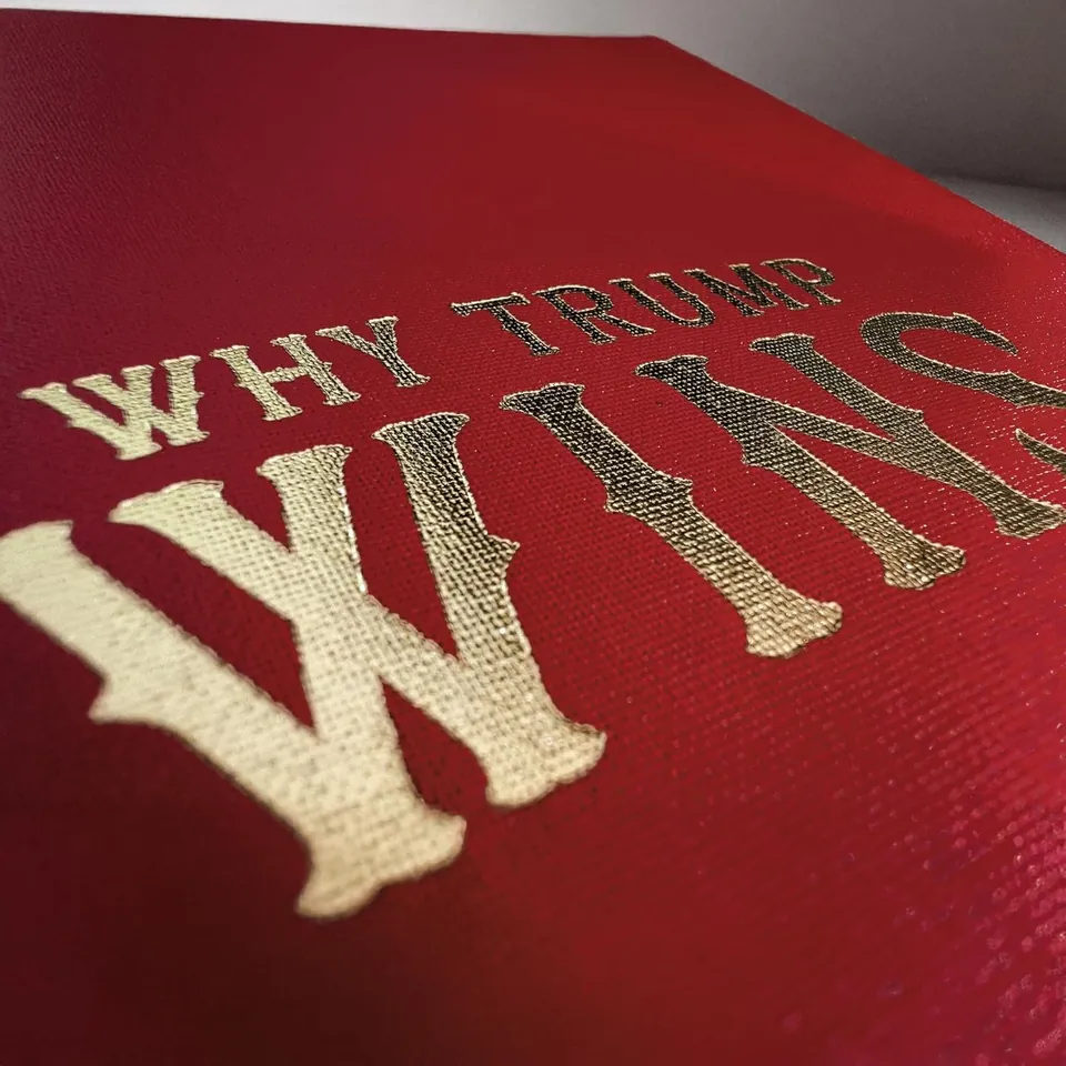 Close-up of gold foil stamping on the scarlet cloth